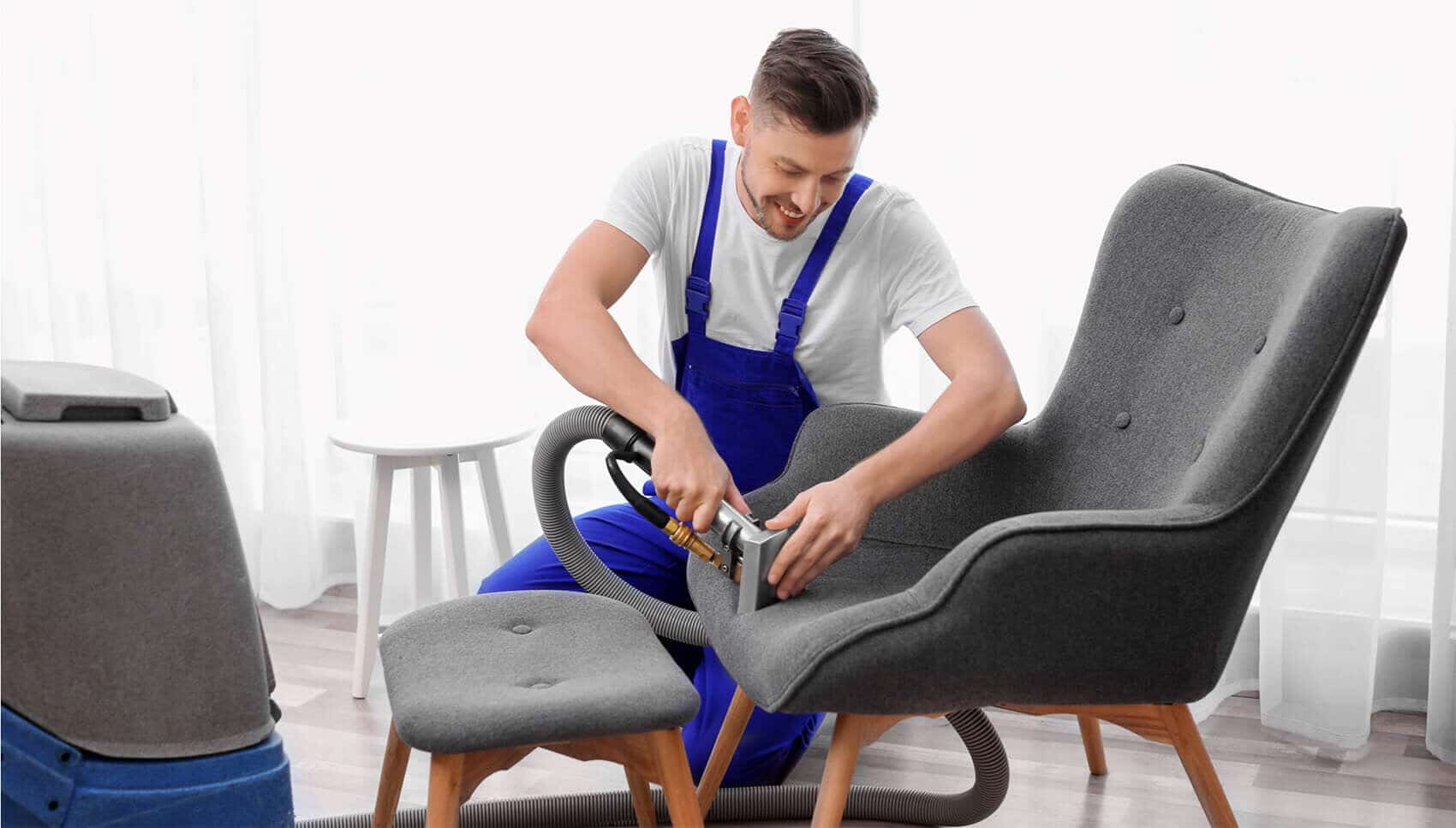 Service Technician Cleaning an Upholstered Chair